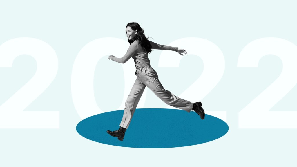 A smiling woman runs across a blue circle with 2022 in the background.