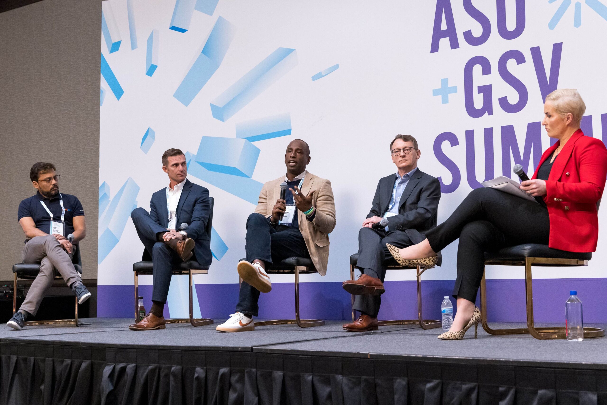 Stephen Green holds a microphone and speaks on a panel at the ASU+GSV Summit