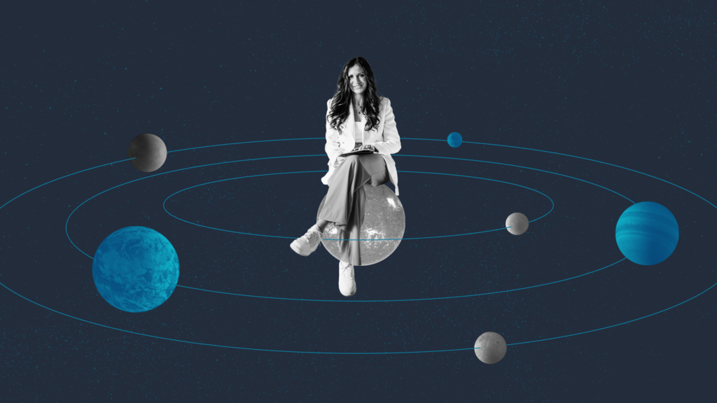 A woman with a tablet sits on a planet in the center of a solar system.