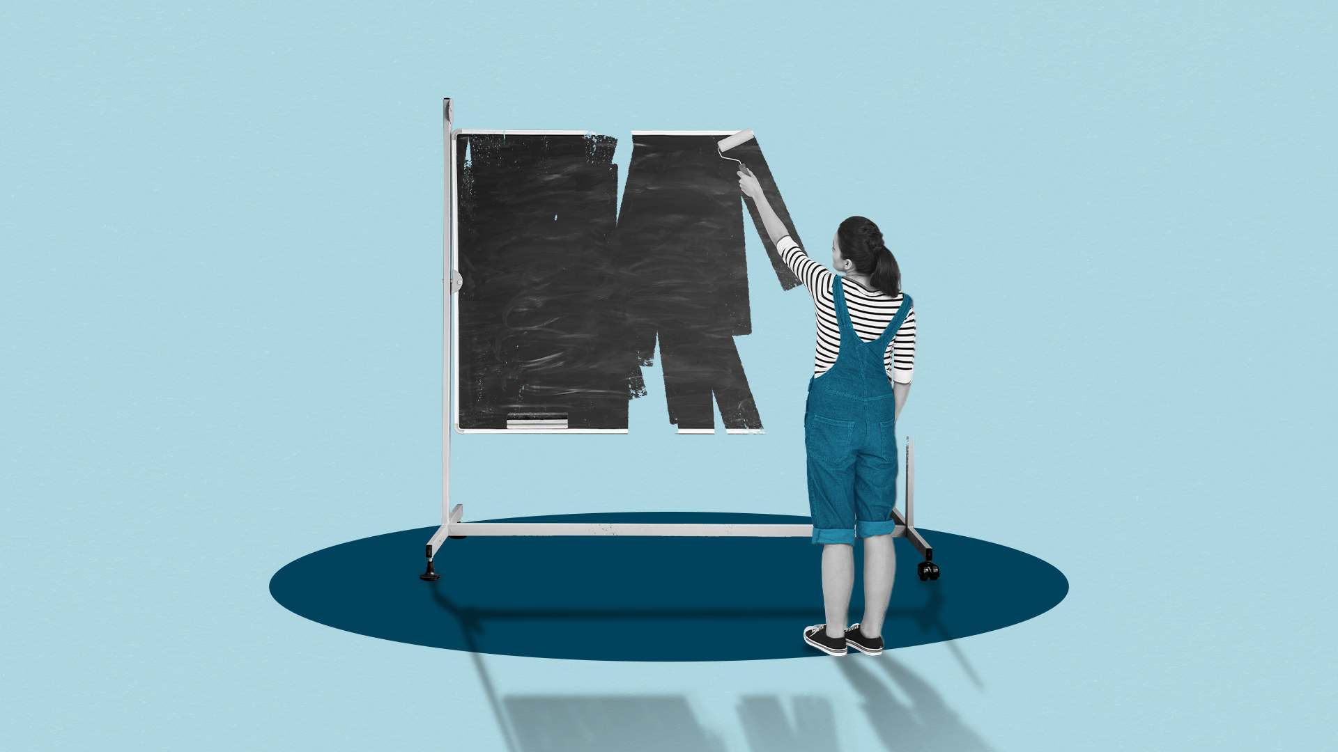 A woman in overalls paints a large black rectangle covering a board on a blue background, casting shadows on the floor.