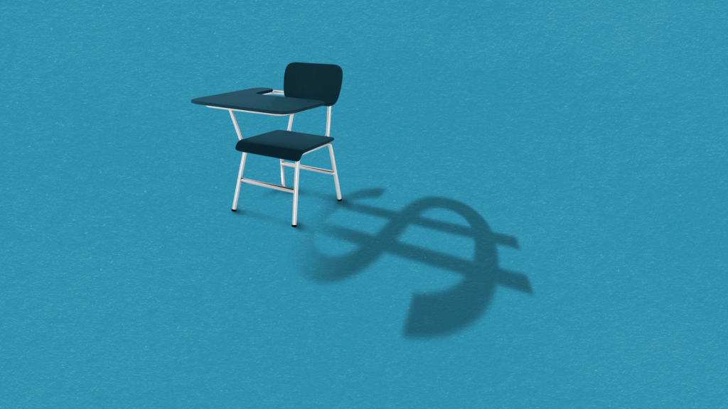 A classroom desk casts a shadow shaped like a dollar sign on a blue background, symbolizing the cost of education.