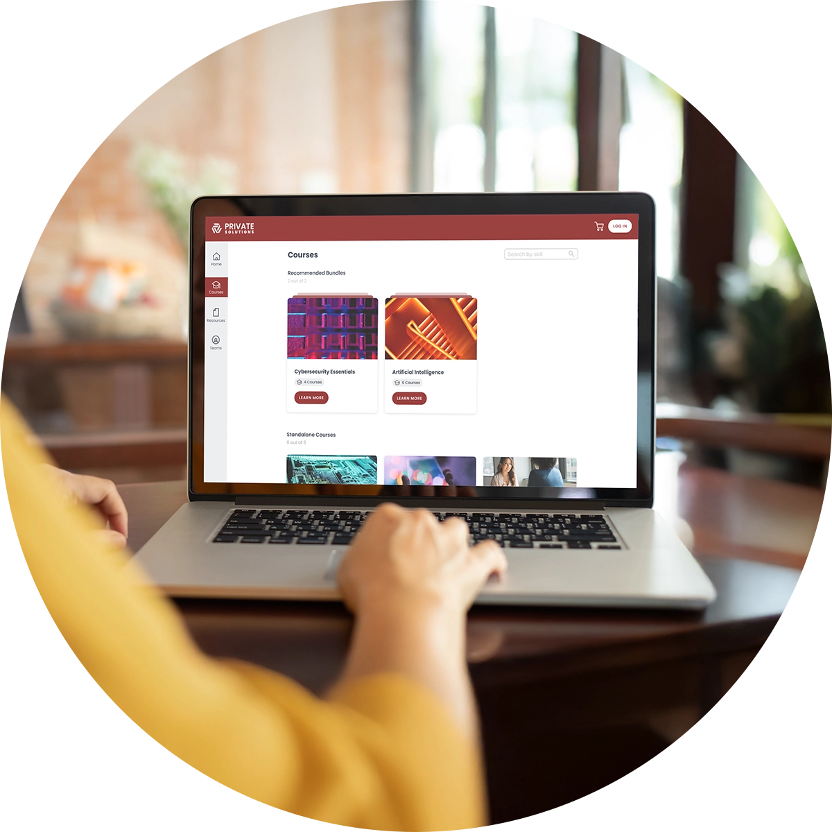 A closeup of hands typing on a laptop.