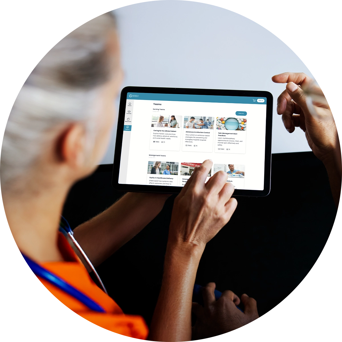 A woman points to the screen of a tablet that displays information about a sample university.