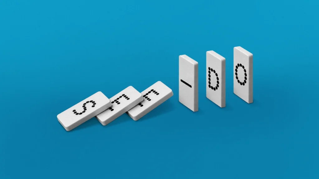 A row of dominos in mid-flight that spell out "SEE" and "DO."