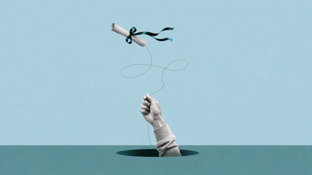 A hand holds a string attached to a diploma with its ribbons flying in the breeze as though it's a kite.