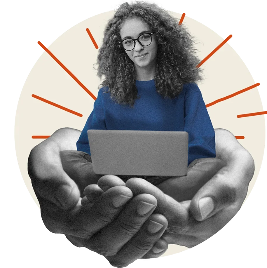 A set of hands cradles a student sitting cross-legged with a laptop on her lap.
